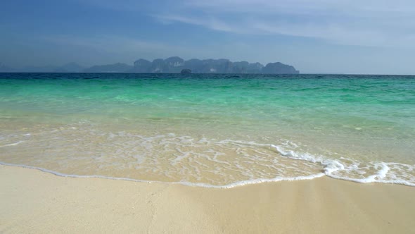 Gimbal Shot of Tropical White Sand Beach with Clear Turquoise Water