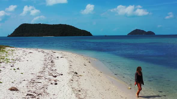 Beautiful ladies happy together on perfect sea view beach lifestyle by blue green sea and white sand