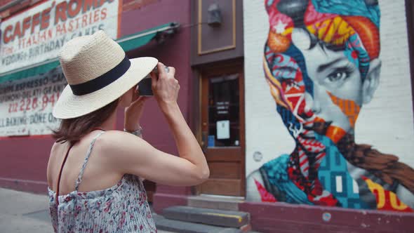 A young girl takes pictures