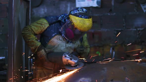 Worker polishing in metal industry