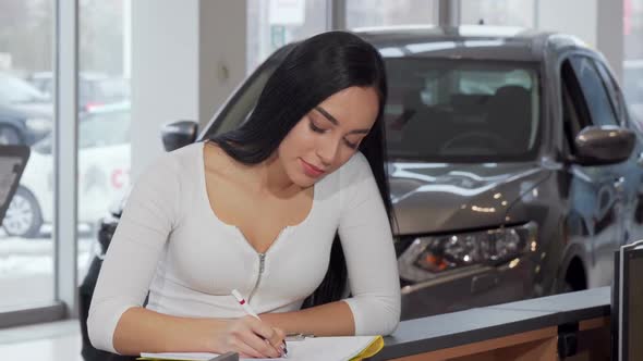 Gorgeous Woman Smiling To the Camera, Signing Papers After Buying New Car 1080p