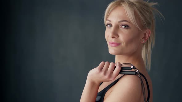 Portrait of Sports Woman with Skipping Rope on His Shoulder