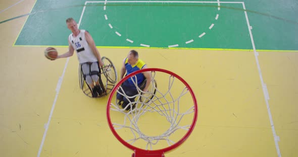 Top View Shot of Persons with Disabilities Playing Basketball in the Modern Hall