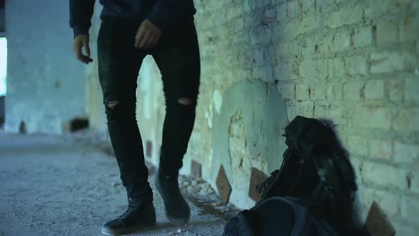 Afro-American Teenager Hiding From Bullying in Abandoned Building