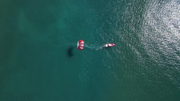 Activity at Sea with a Parachute Attached to the Boat