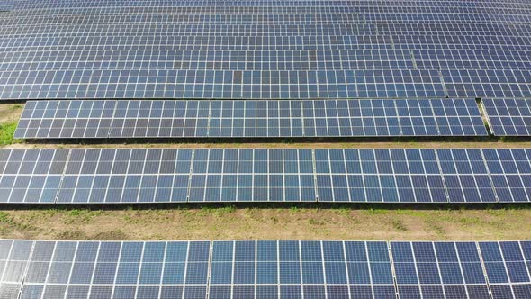 Aerial View of Solar Power Station. Solar Farm. Field of Solar Panels in a Row