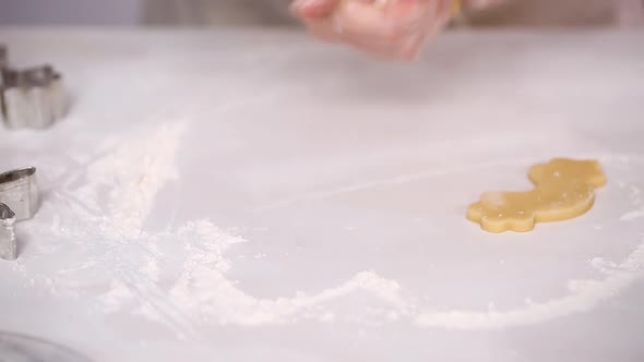 Step by step. Cutting out sugar cookies with unicorn shaped cookie cutters.