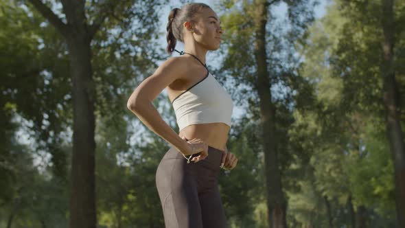 Sporty Fit Woman Doing Squat Exercises Outdoors