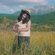 Girl With Hat In Mountain Meadow - VideoHive Item for Sale