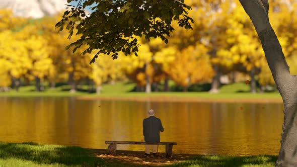 Grandfather Sitting On A Bench In The Autumn Park alt