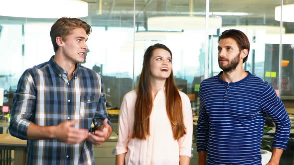 Executives interacting with each other in office