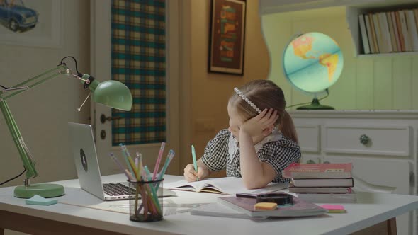 Tired of Home Schooling and Online Education Kid Falling Asleep on Textbook