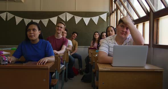 Teenagers in a school classroom alt