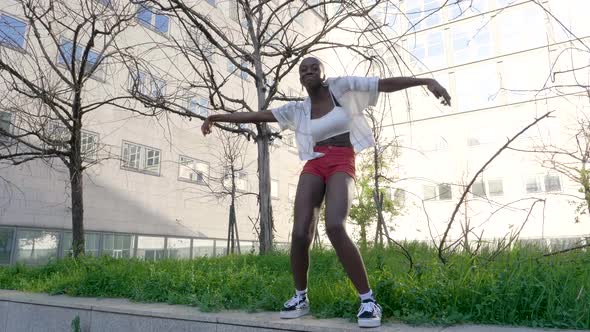 Slow motion shot of young woman dancing outdoors