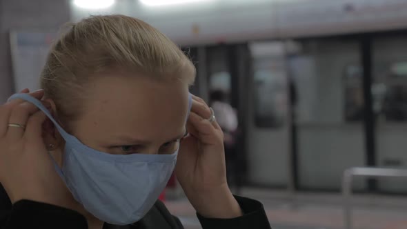 In Hong Kong, China in Subway a Young Girl Wears a Medical Mask