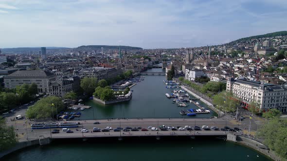 Static drone 4k clip of busy Quai Bridge crossing the Limmat river in Zurich, Switzerland.