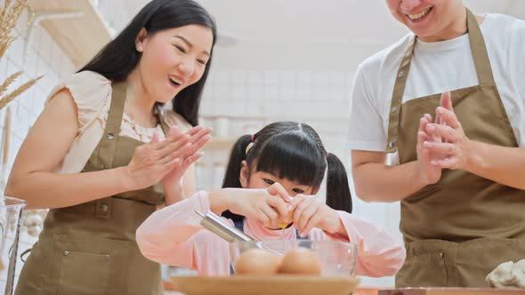 Asian happy family stay home in kitchen bake bakery and food with kid enjoy activity in house.