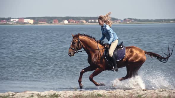 Laughing Female Riding Horse through Water