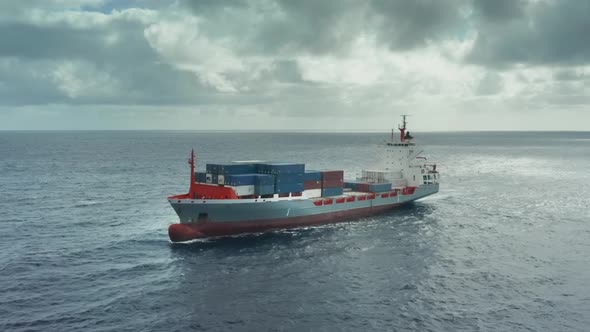 Transcontinental Transportation of Containers with Different Goods on the Cargo Ship in the Open Sea