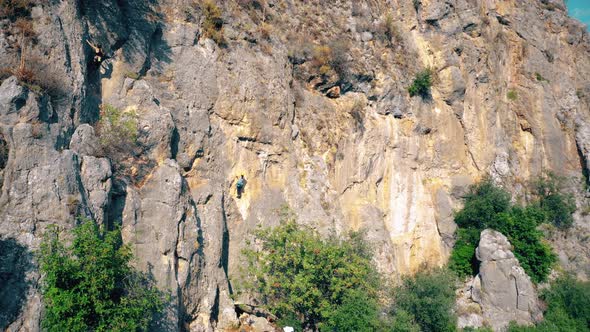 Rock Climbers Climbing on the Mountains Cliff