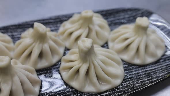 Traditional Georgian dumplings, Khinkali, with minced meat on a plate