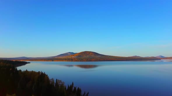 Aerial Video of Beautiful Mountain Lake on a Frosty Autumn Morning.