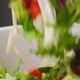 Fresh Salad Falling Into Bowl on Black Background - VideoHive Item for Sale