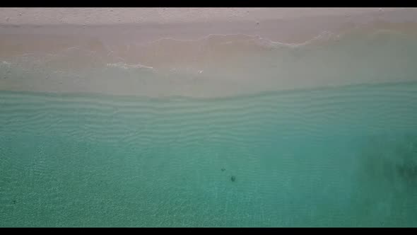 Aerial flying over seascape of paradise coastline beach adventure by blue ocean and white sand backg