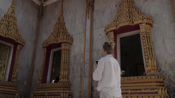 Young Tourist Woman Making Photo with Mobile Phone of Thai Buddhist Temple