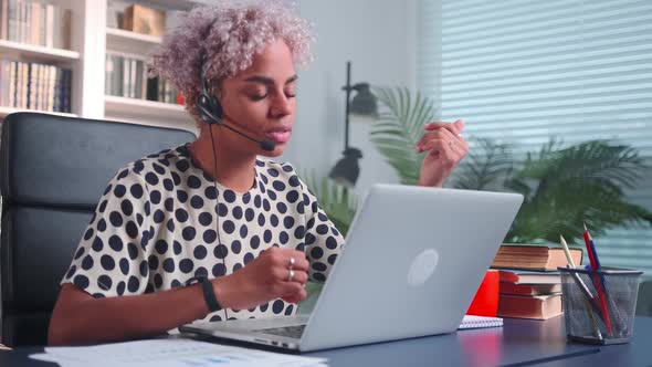 Young African American Woman Bank Employee with Headset and Microphone on Head