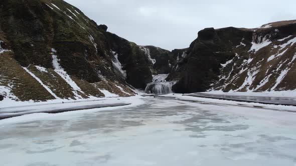 Aerial view of Stjornarfoss waterfall in wintertime in Iceland.