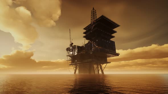 Offshore Jack Up Rig in The Middle of The Sea at Sunset Time alt