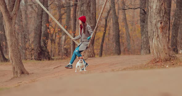 Nice Girl Swinging on a Swing in the Park