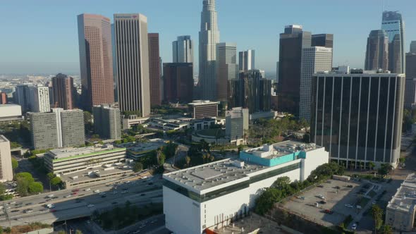 AERIAL: Wide View of Downtown Los Angeles, California Skyline at Beautiful Blue Sky and Sunny Day 