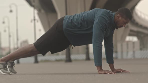 Black Man Doing Push Ups Outdoors