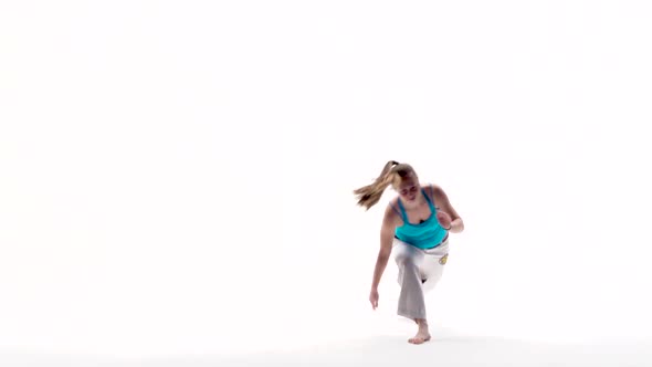 Woman Performing Incredibly Complex of Martial Art of Capoeira.