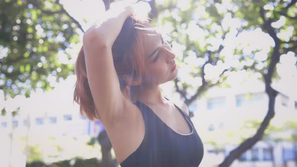 Young Woman Stretching Arms