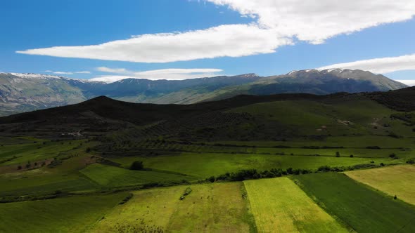 Aerial Panoramic View of Scenic Landscape in the Alps with Rugged Alpine Mountain Peaks and Lush