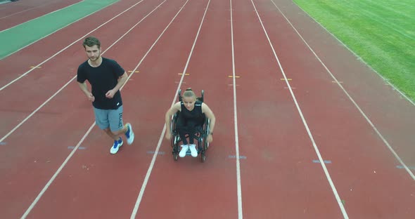 Hero Portrait Shot of Disabled Sport People on Athletics Sports Track