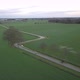 Aerial Cinematic Clip Drone Flying Over a Farm Field During Sunset - VideoHive Item for Sale