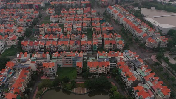 Foggy,smoggy early morning drone footage over urban villa housing developments in district seven Sai