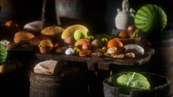 Food Table with Wine Barrels and Some Fruits Vegetables and Bread alt