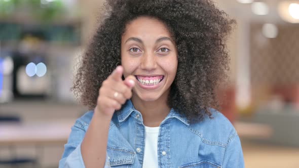 African Woman Pointing with Finger