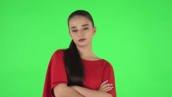 Portrait of Pretty Young Woman Is Very Offended and Looking Away and Then Smiling. Green Screen