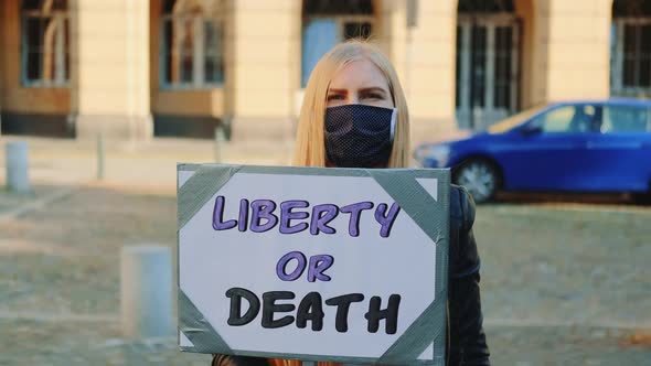 Blonde Woman with Protest Banner Calling to Choose Liberty or Death