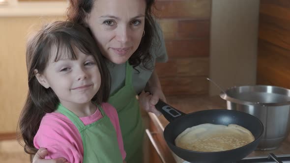 The family makes pancakes. 