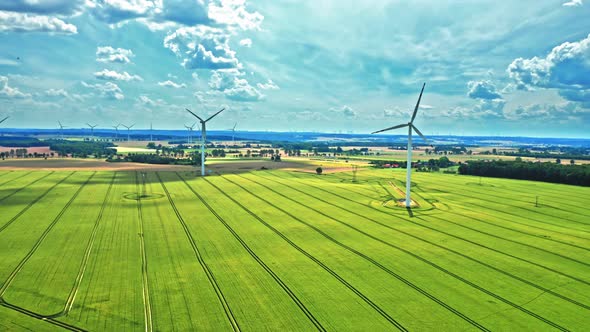 Wind turbines on green field. Alternative energy. Green energy.