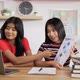 Portrait of Two Asian schoolgirl studying online on laptop and presentation - VideoHive Item for Sale
