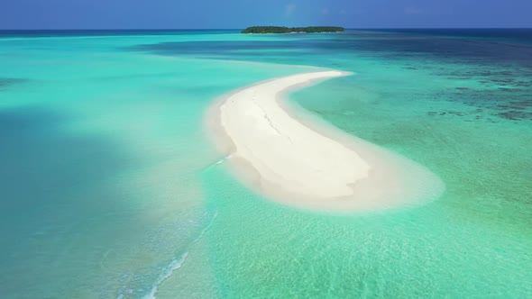 Aerial drone shot sky of paradise bay beach lifestyle by shallow ocean with bright sand background o