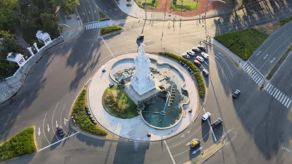 Drone birdseye view above Monument of the Spanish traffic roundabout Buenos Aires at sunset